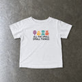 All The Small Things Colorful infant tee in white, laid flat