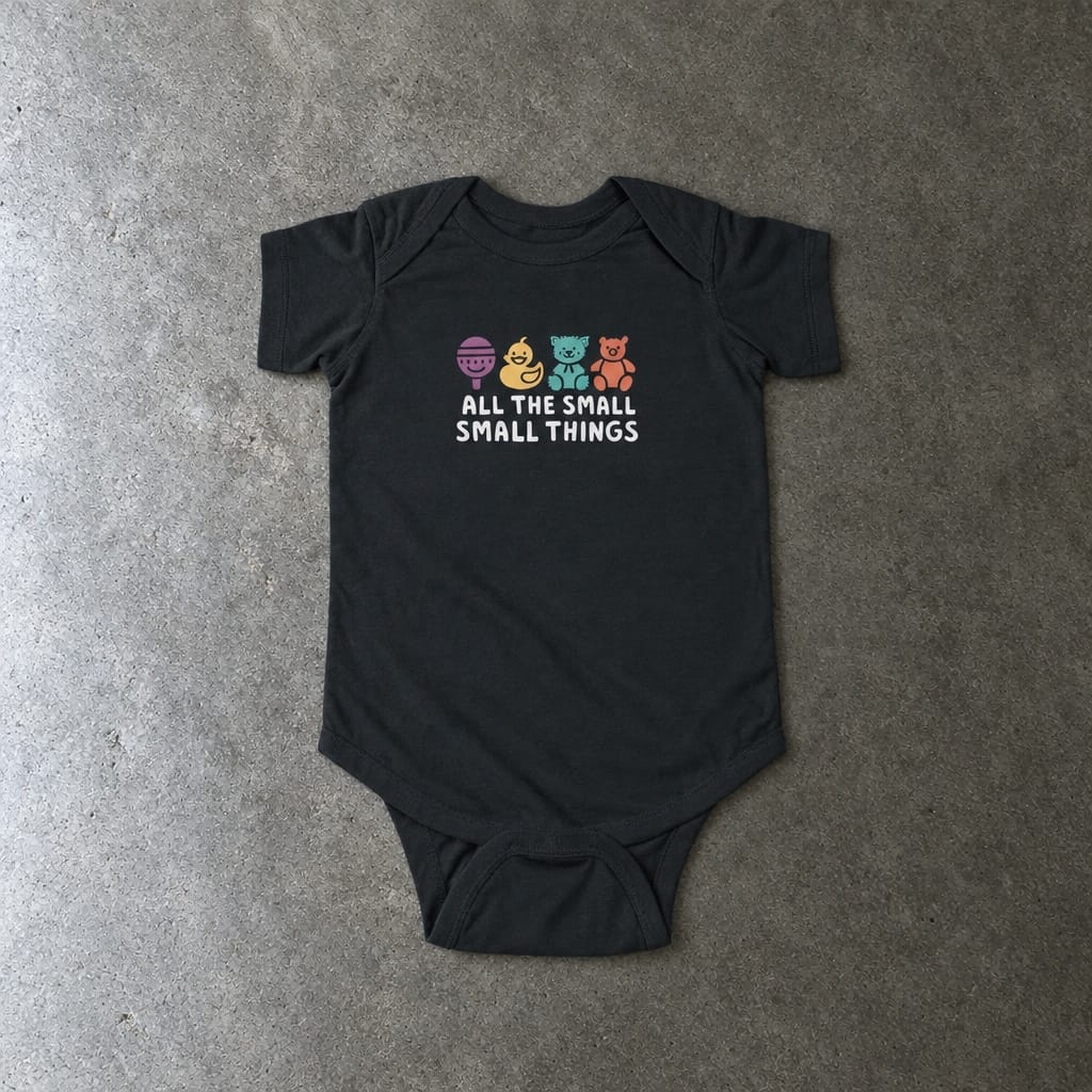 All The Small Things Colorful onesie in black, laid flat