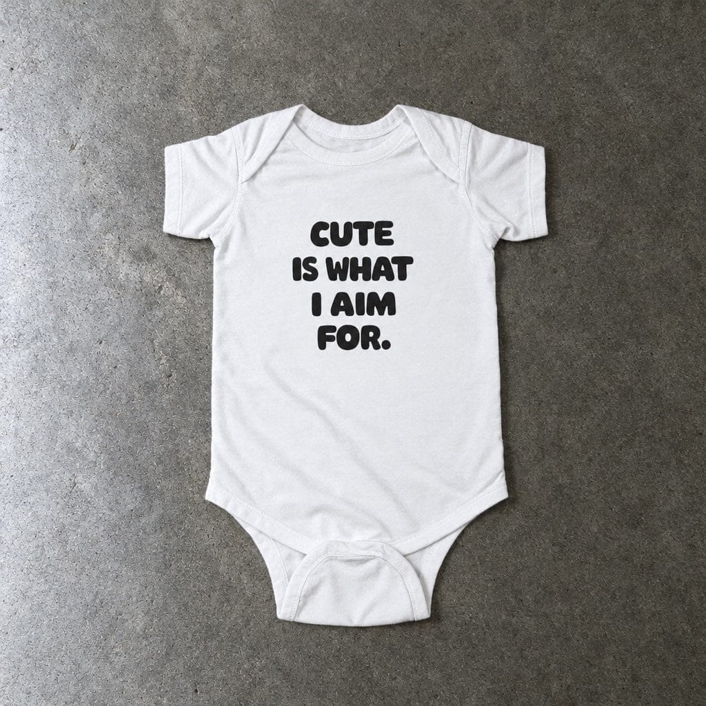 Cute Is What I Aim For onesie in white, laid flat