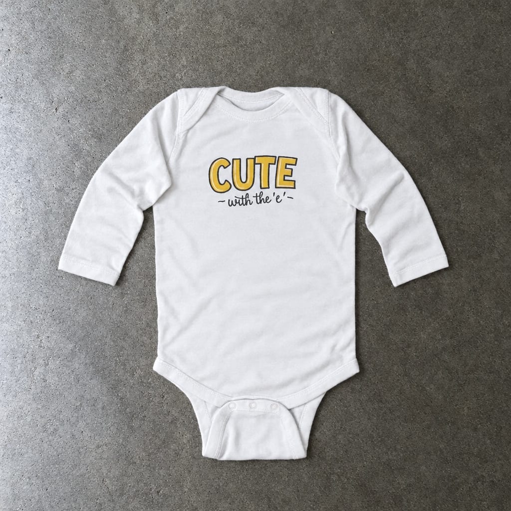 Cute with the E long sleeve onesie in white, laid flat