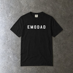 emodad Tee on Comfort Colors in black, laid flat