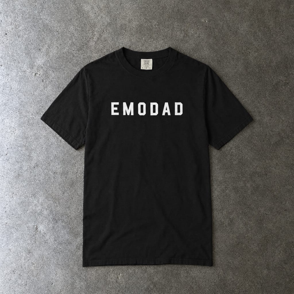 emodad Tee on Comfort Colors in black, laid flat