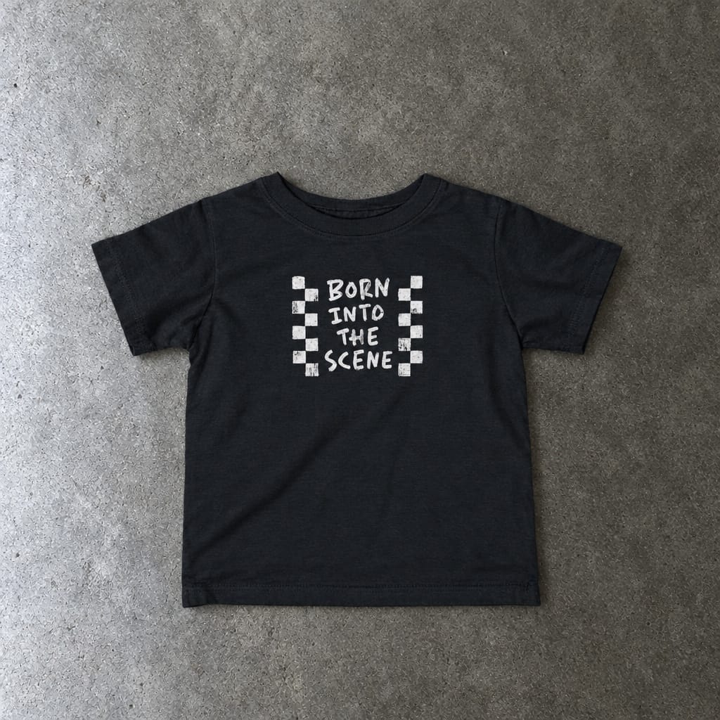 Born into the Scene Baby Tee in black, laid flat