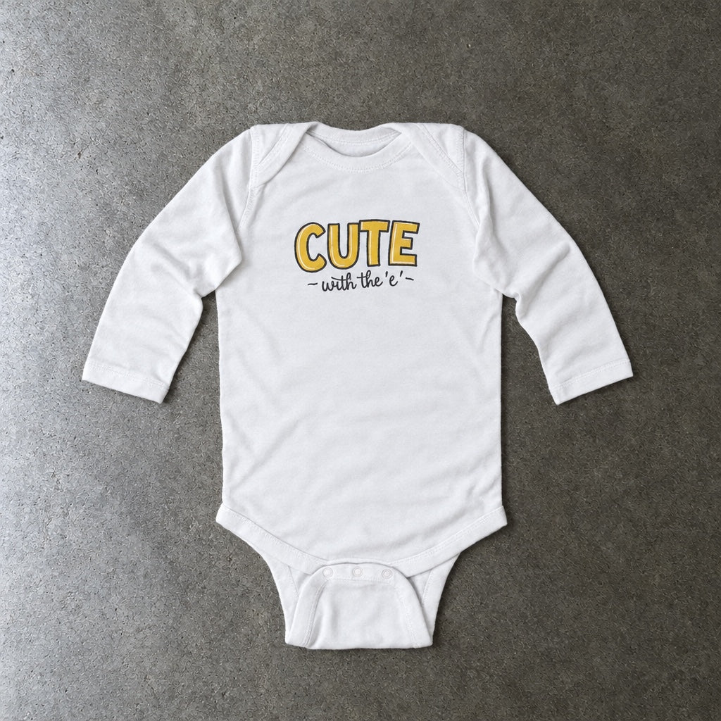 Cute with the E long sleeve onesie in white, laid flat