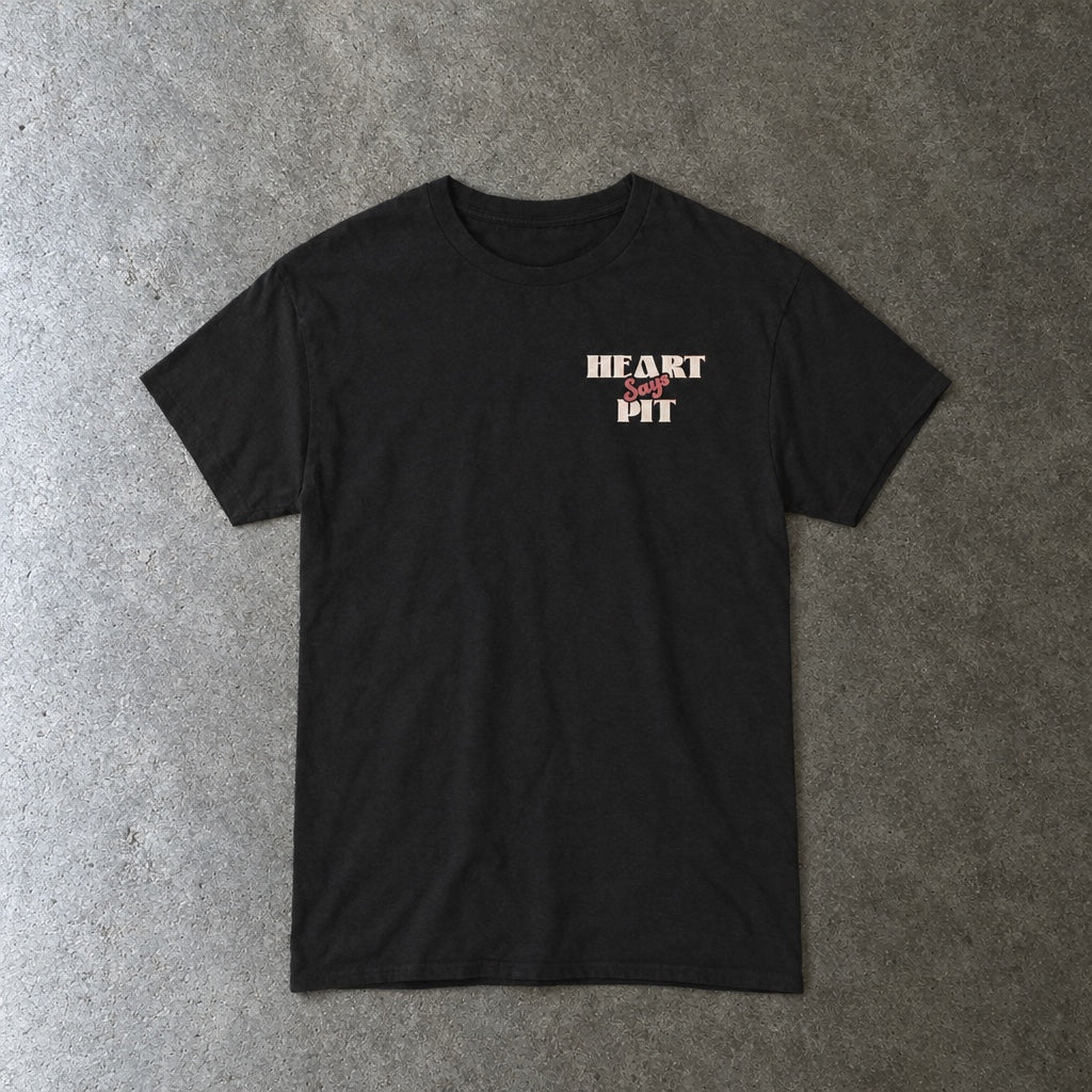 Heart Says Pit, Knees Say Sit Tee toddler tee in black, laid flat
