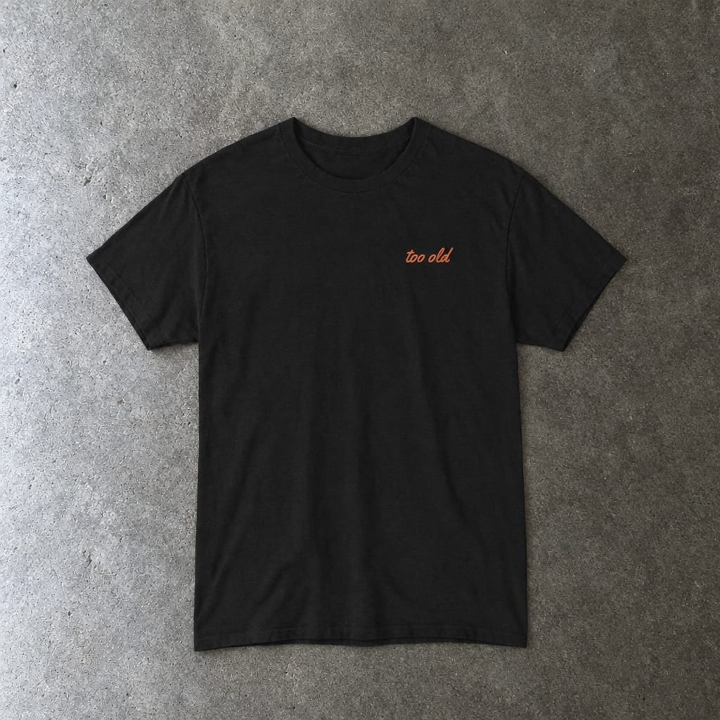 I'm Too Old For This Pit Danny Tee in black, laid flat