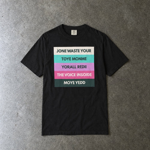 Jone Waste Your Toye Monme on Comfort Colors toddler tee in black, laid flat