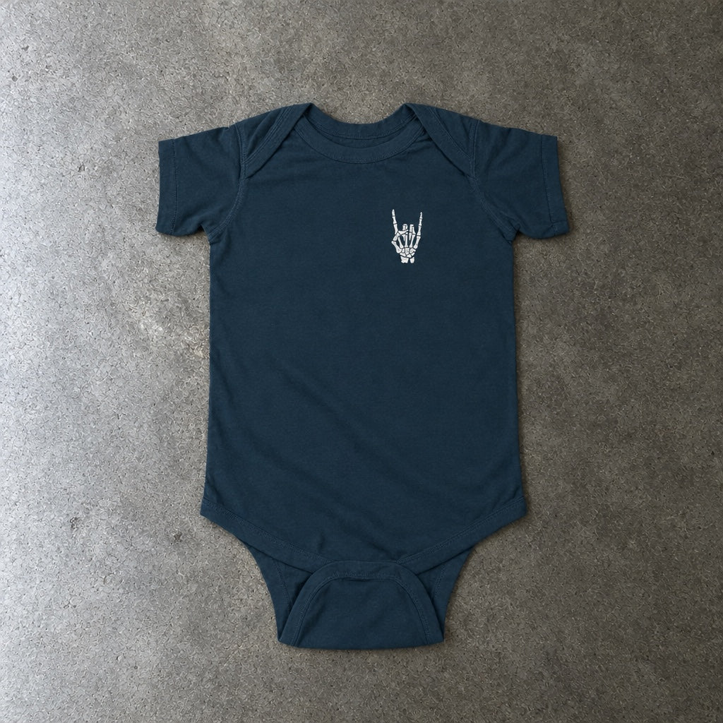Rock On onesie in navy, laid flat