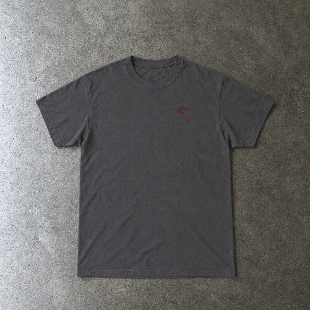 Still Emo Flower Tee toddler tee in charcoal, laid flat