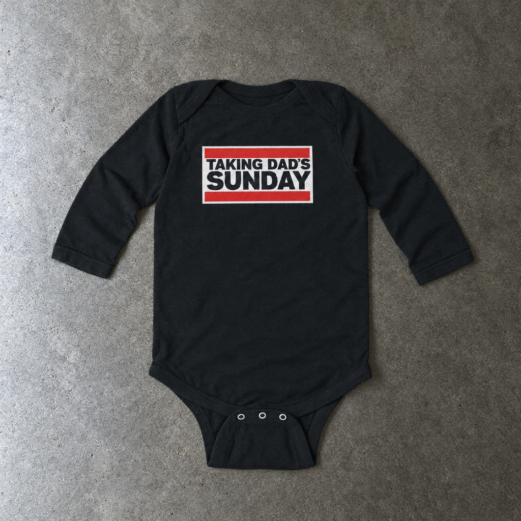 Taking Dad's Sunday long sleeve onesie in black, laid flat