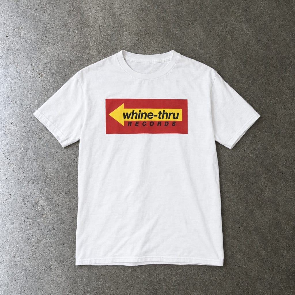 Whine-Thru Records youth tee in white, laid flat