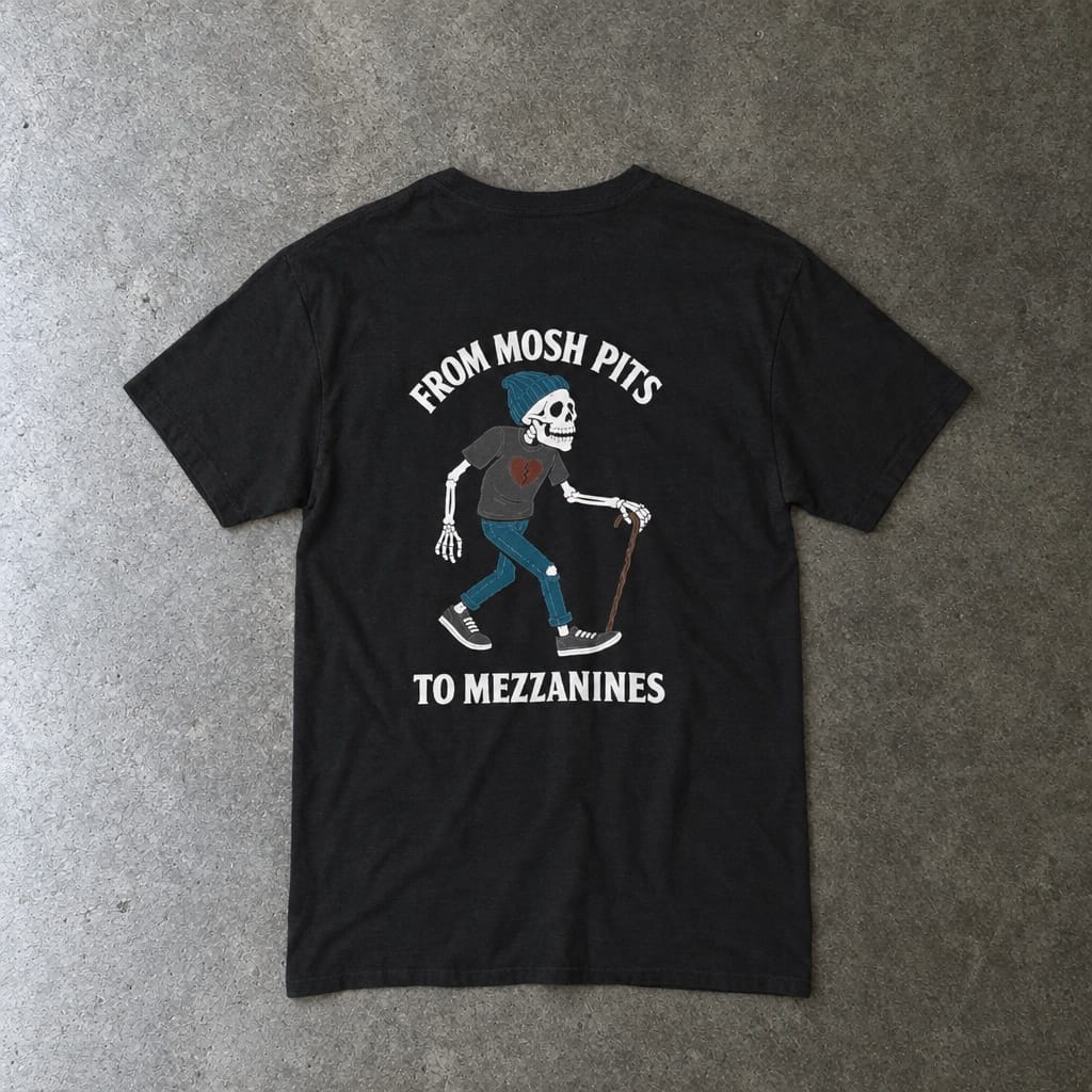 From Mosh Pits to Mezzanines Tee in black, laid flat, back view