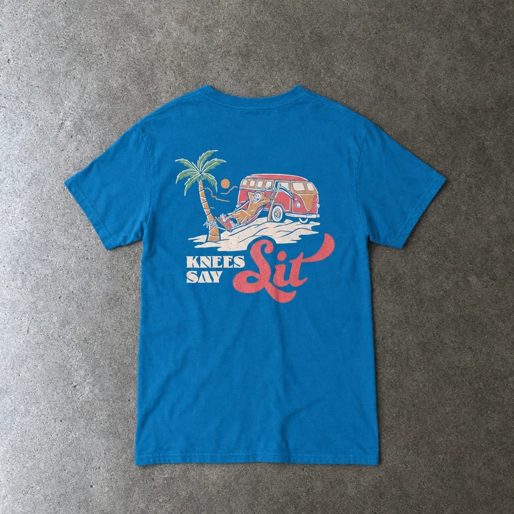 Heart Says Pit, Knees Say Sit Tee in sapphire, laid flat, back view
