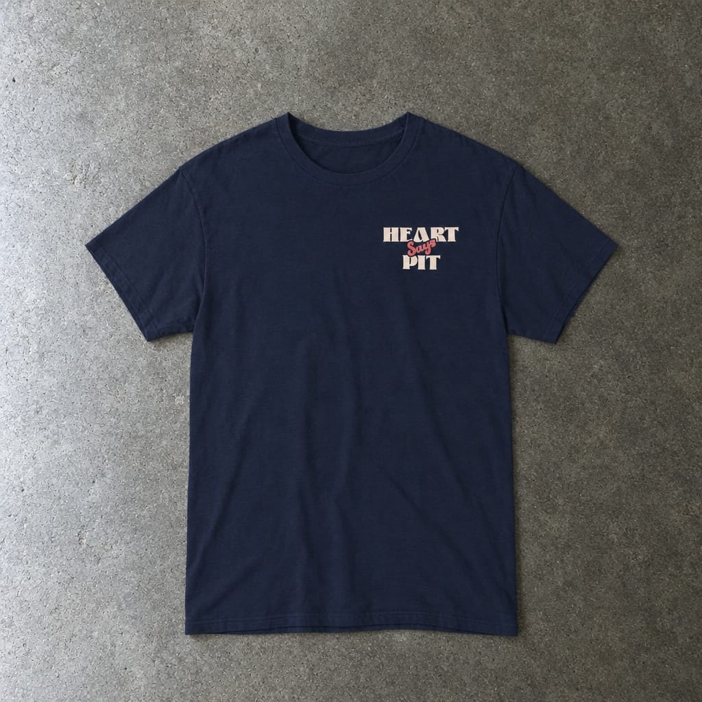 Heart Says Pit, Knees Say Sit Tee in navy, laid flat
