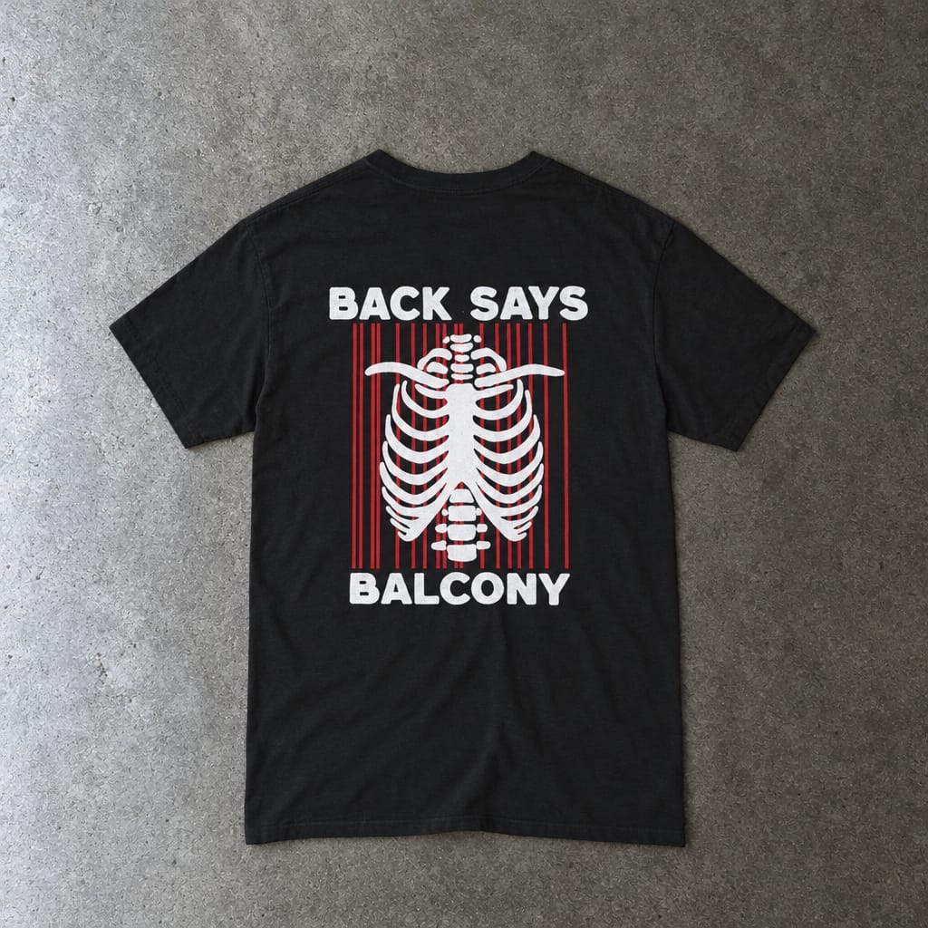 Hearts Says Pit, Back Says Balcony Tee in black, laid flat, back view
