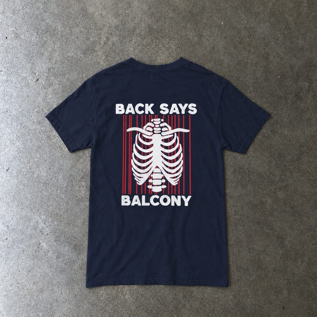 Hearts Says Pit, Back Says Balcony Tee in navy, laid flat, back view