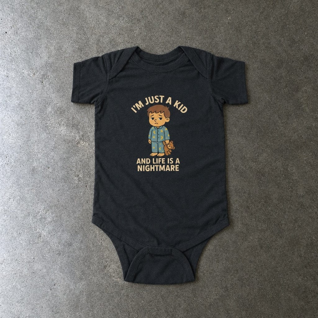 I'm Just A Kid onesie in black, laid flat
