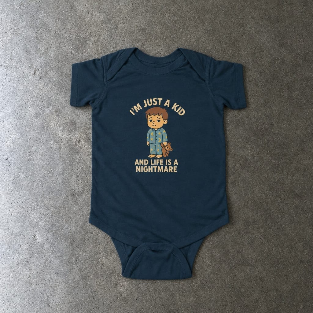 I'm Just A Kid onesie in navy, laid flat