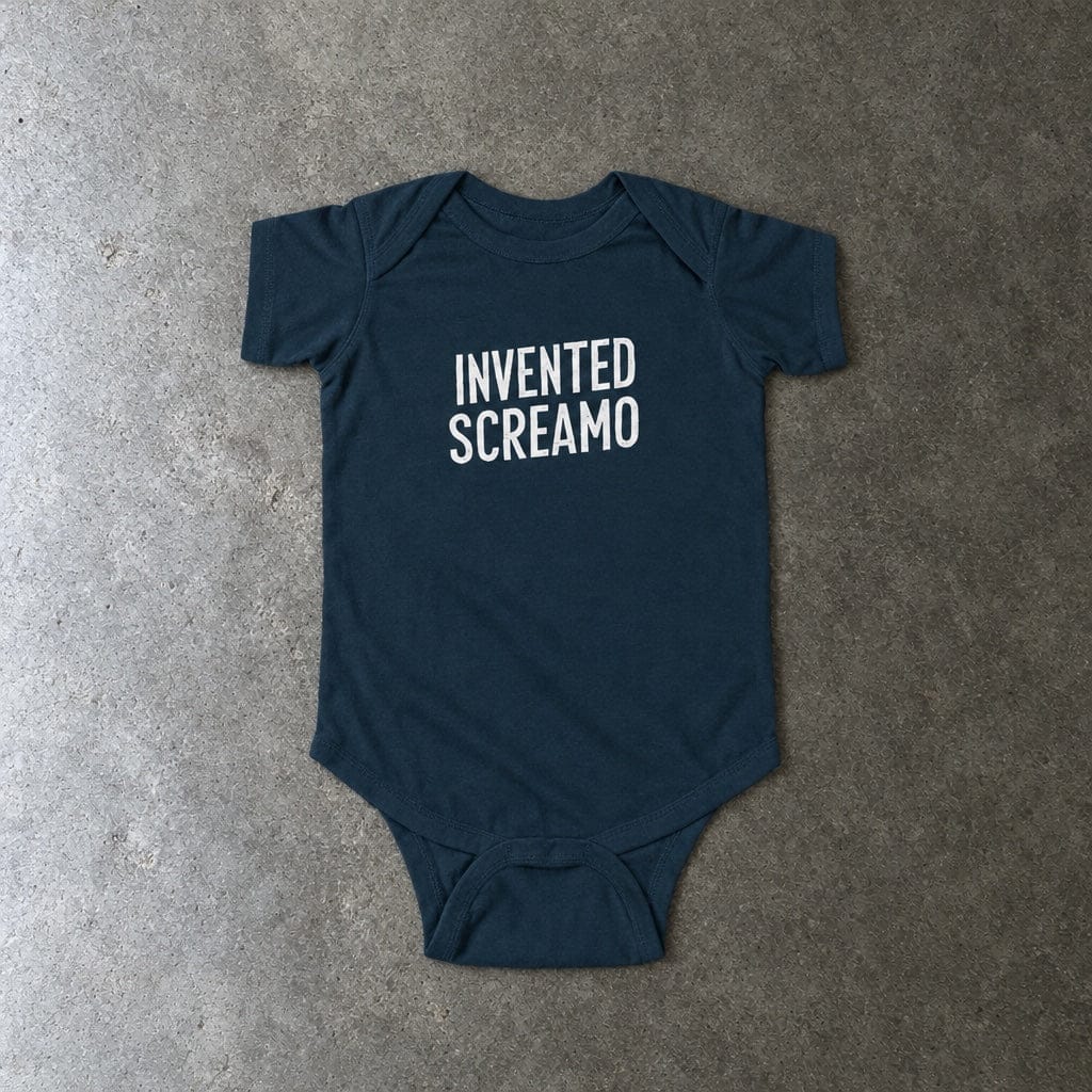 Invented Screamo onesie in navy, laid flat