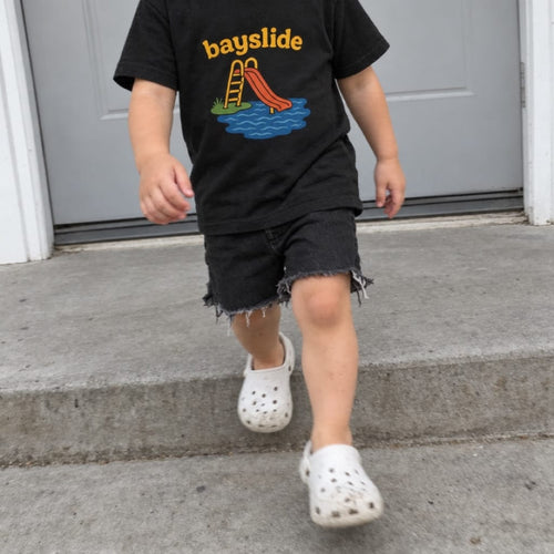 Toddler wearing the Bayslide toddler tee