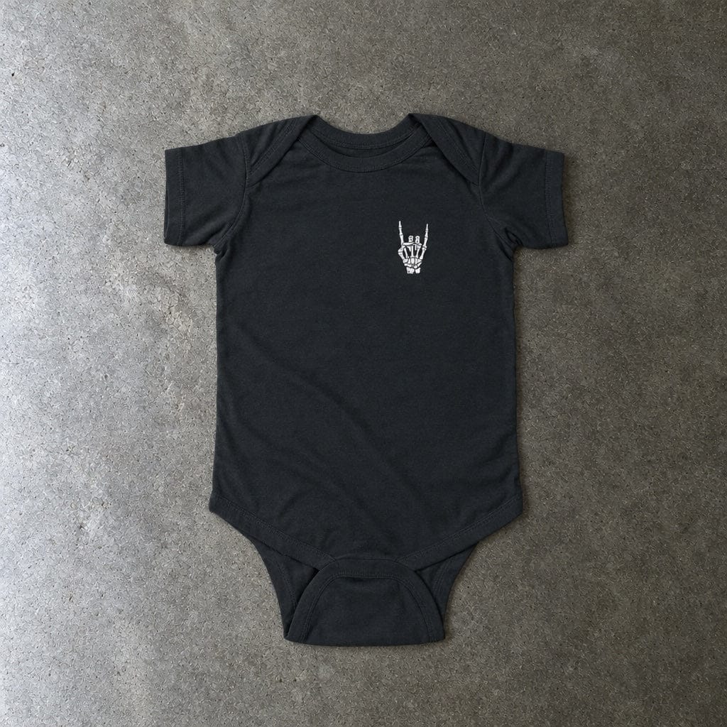 Rock On onesie in black, laid flat