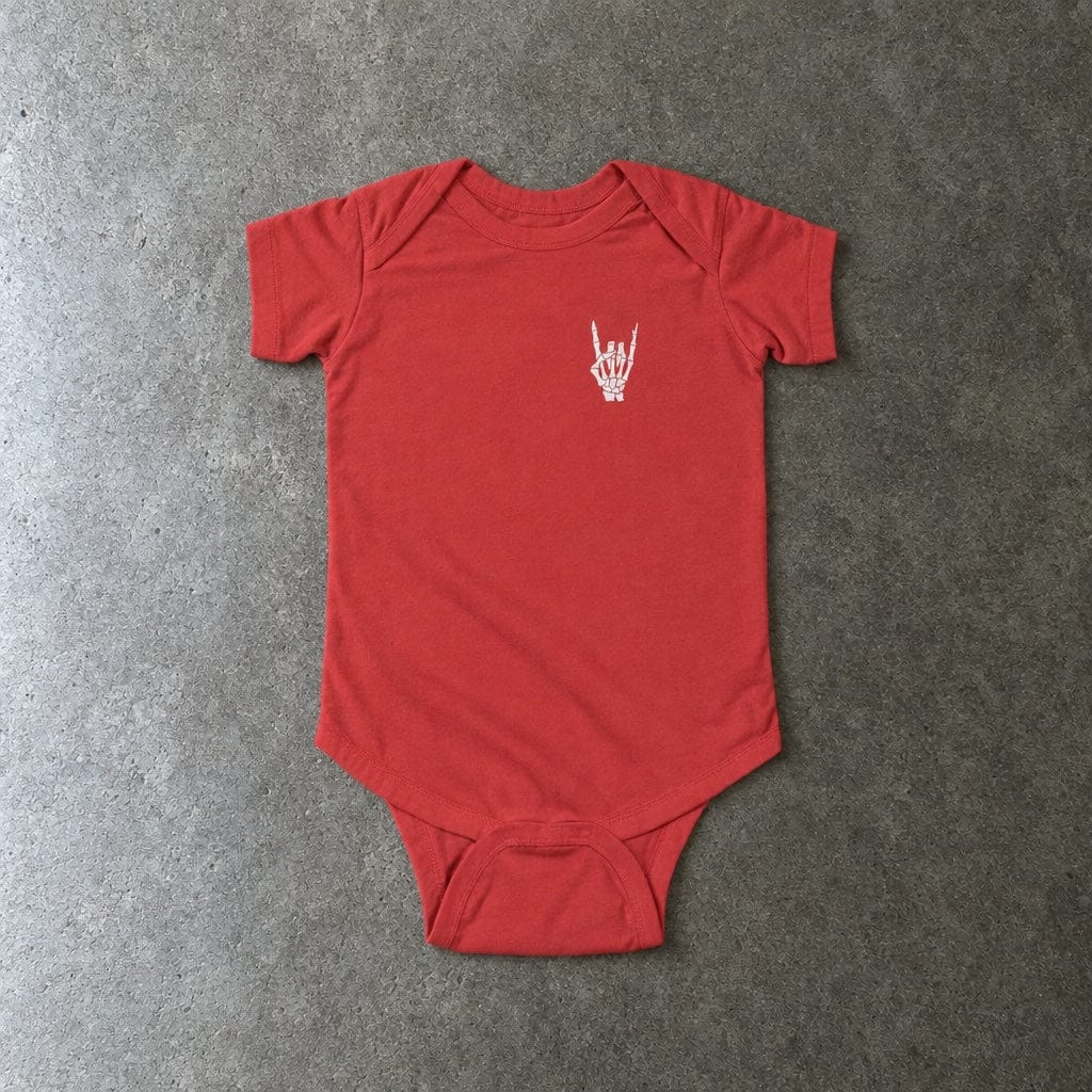Rock On onesie in red, laid flat