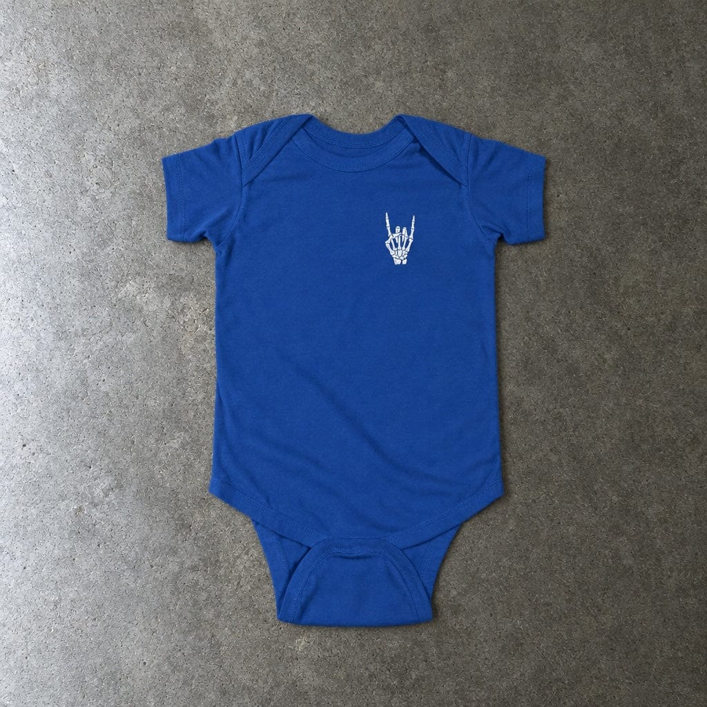 Rock On onesie in royal, laid flat