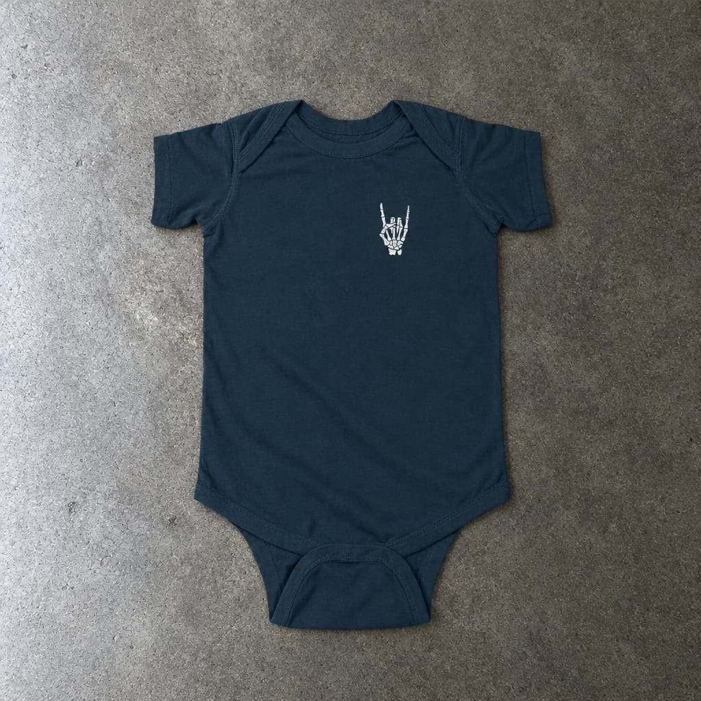 Rock On onesie in navy, laid flat