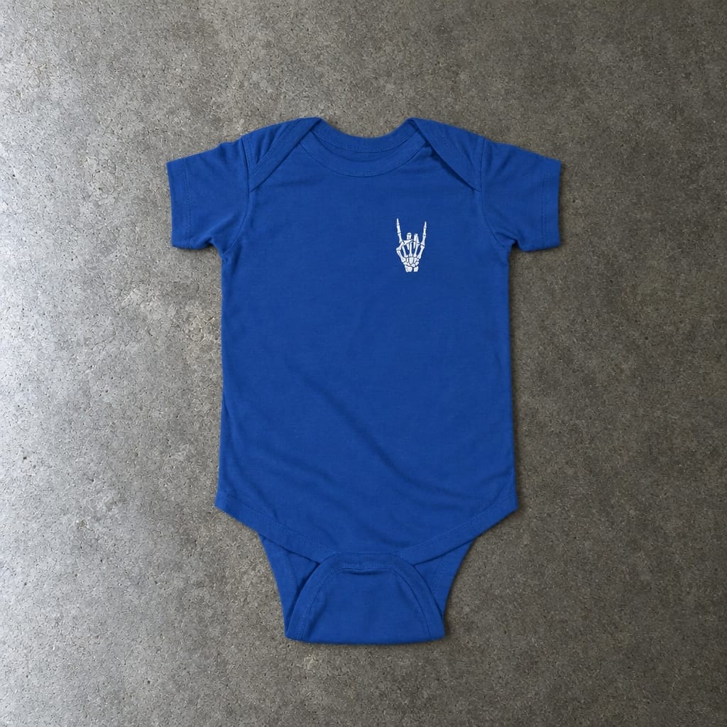 Rock On onesie in royal, laid flat